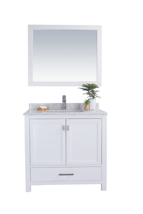White bathroom vanity with marble countertop and matching mirror.