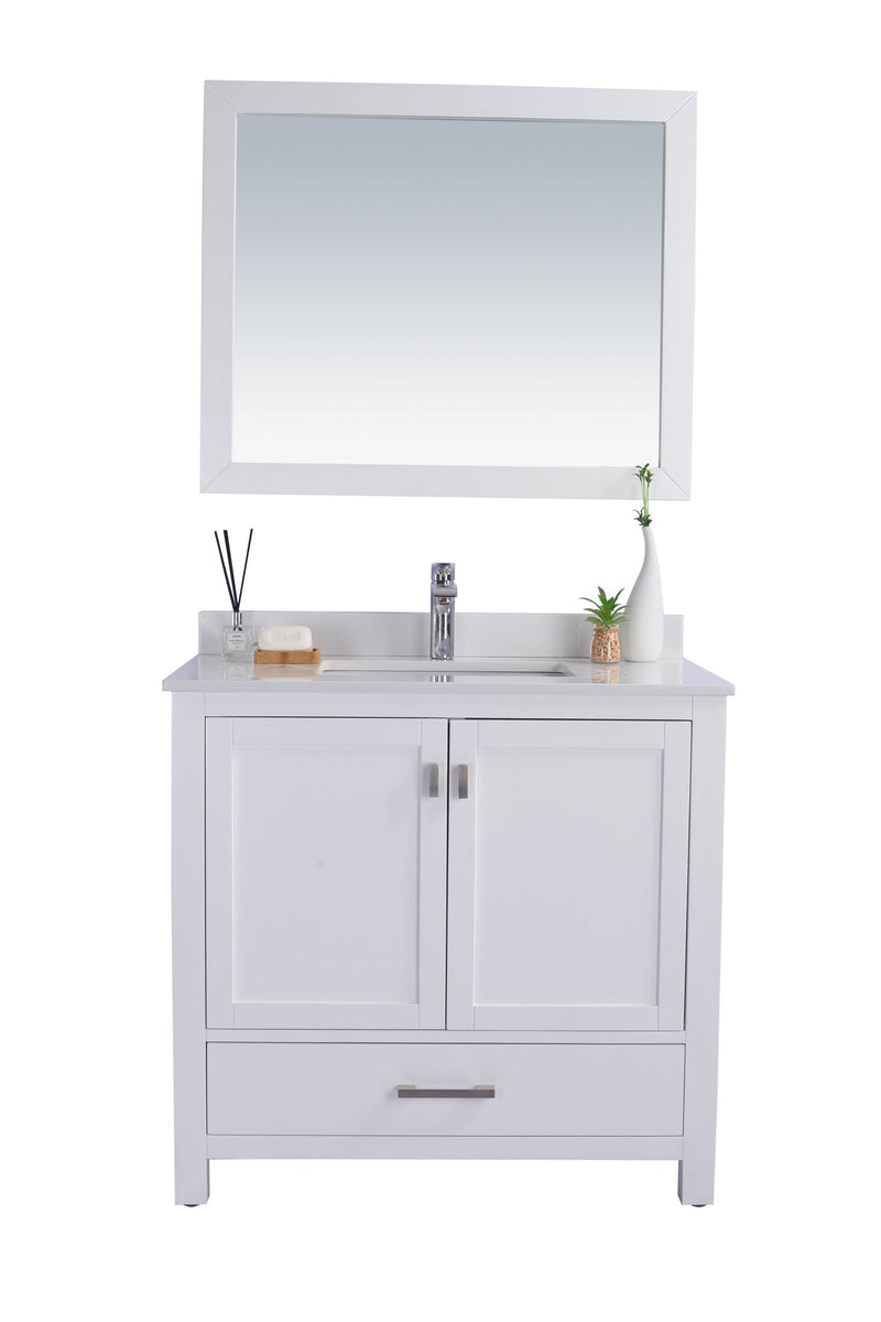 White bathroom vanity with mirror.