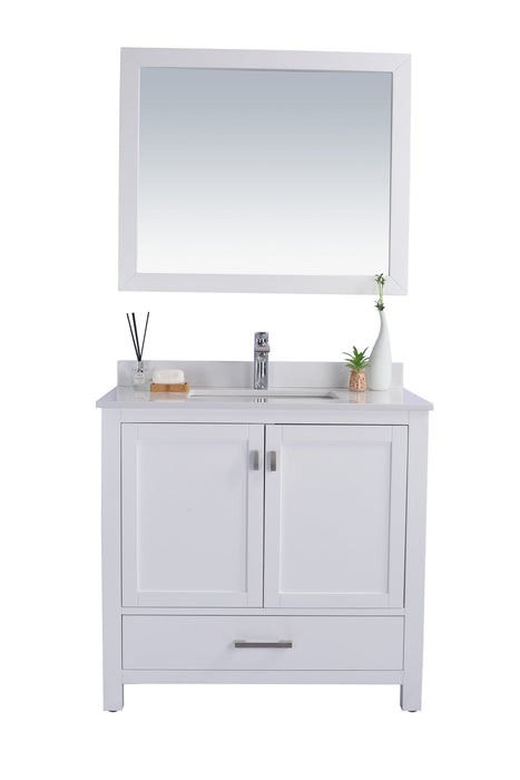 White bathroom vanity with mirror.