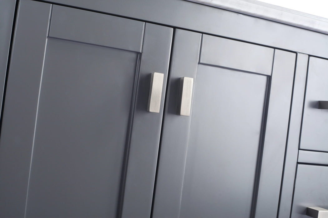 Gray bathroom cabinet with silver handles.