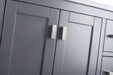 Gray bathroom cabinet with silver handles.