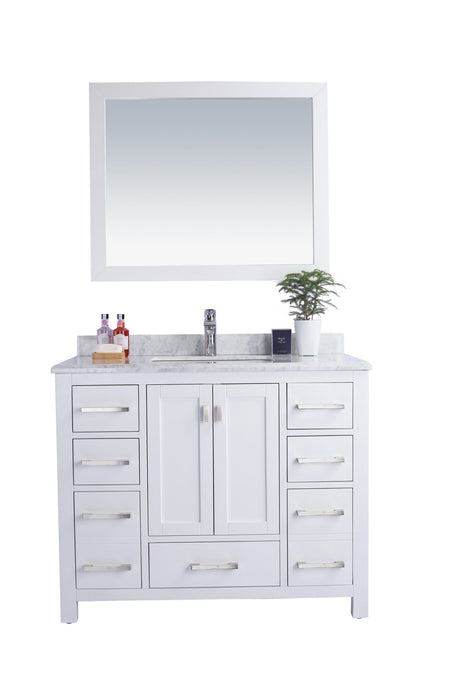 White vanity with marble top, silver hardware, and mirror.
