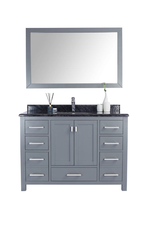 Gray vanity with a dark countertop, silver hardware, and a matching mirror.