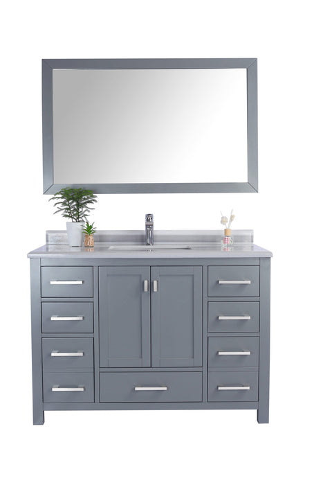 Gray bathroom vanity with mirror, marble countertop, sink, faucet, and plants.