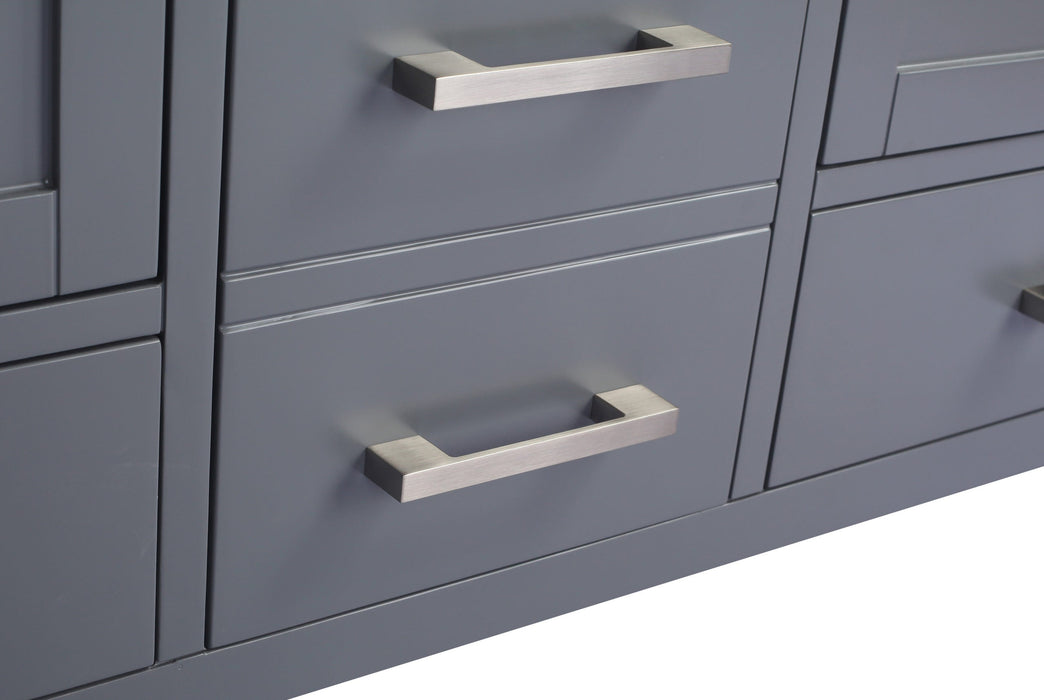 Close-up of gray cabinet drawers with silver handles.