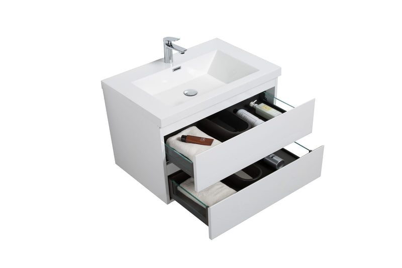 White bathroom vanity with two open drawers and sink.