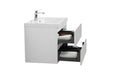 White bathroom vanity with open drawers.