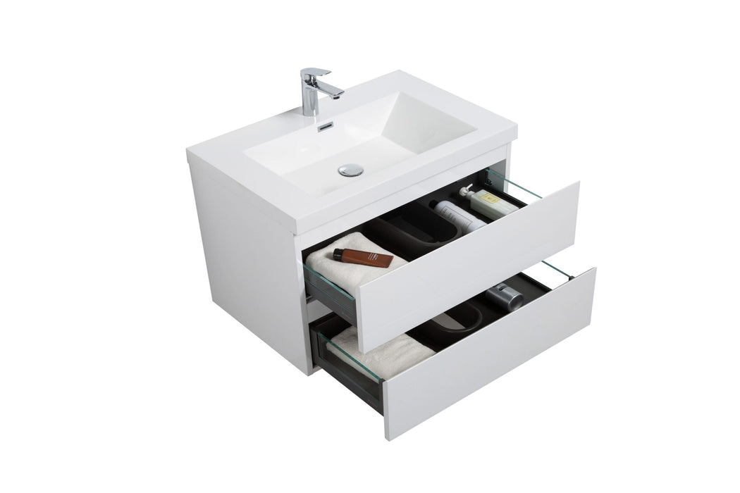 White bathroom vanity with drawers and sink.