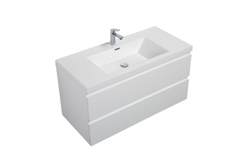 White bathroom vanity with a faucet and two drawers.