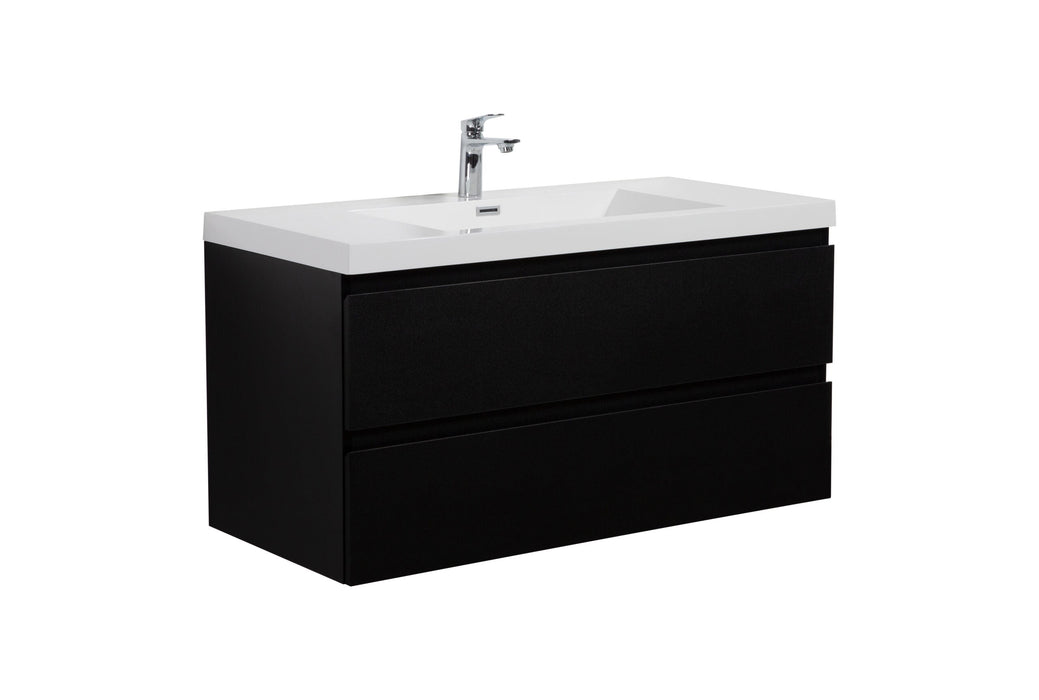 Black bathroom vanity with white sink and chrome faucet.