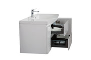 White bathroom vanity with open drawers.