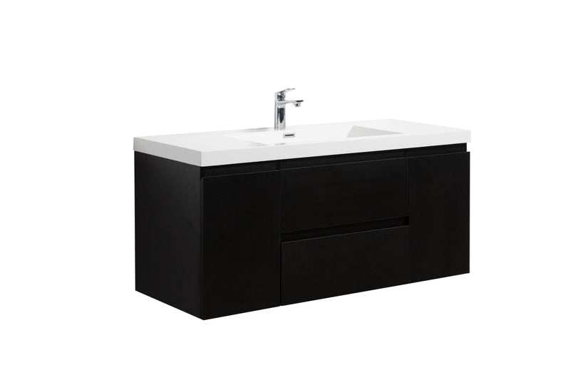 Black vanity with white countertop and silver faucet.