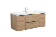 Bathroom vanity with a white top and light wood drawers.
