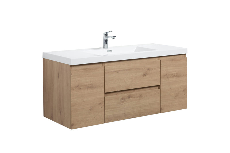 Bathroom vanity with a white top and light wood drawers.
