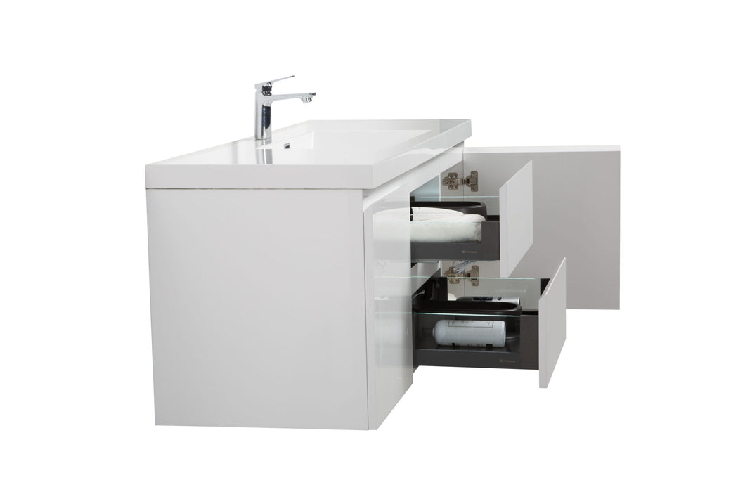 White bathroom vanity with drawers and faucet.