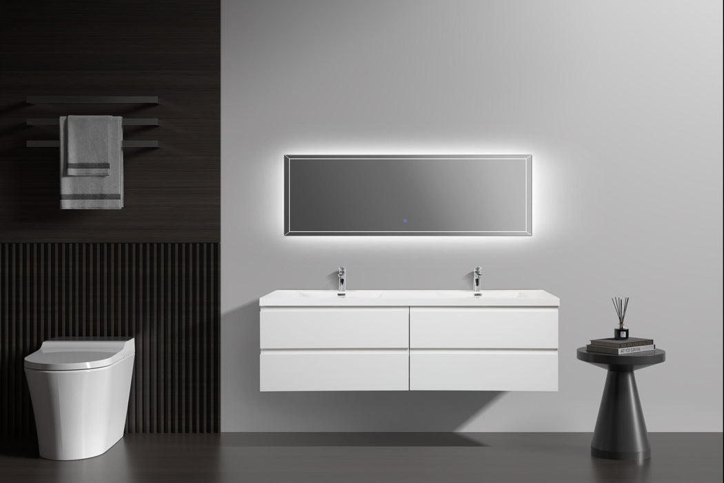 Modern bathroom with double vanity, lighted mirror, and dark wood accents.
