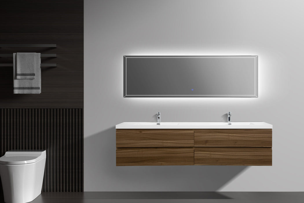 Modern bathroom with floating wood vanity, illuminated mirror, toilet, and towel rack.