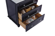 Black bathroom vanity with three drawers open.
