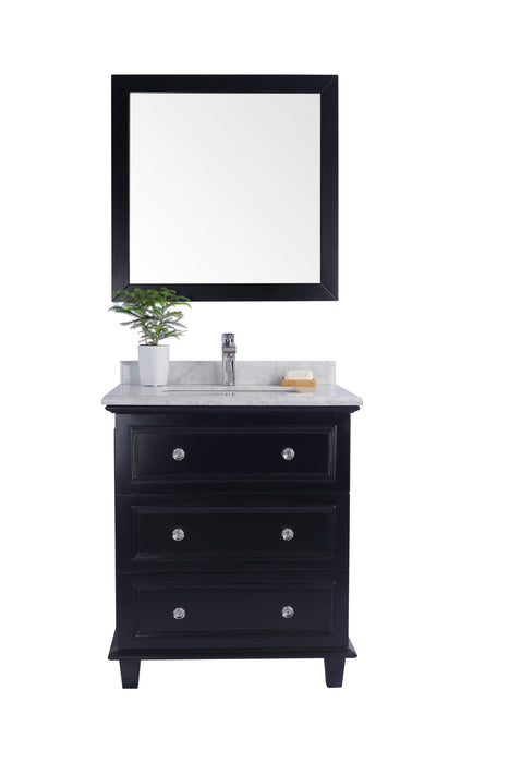 Black vanity with marble countertop, silver faucet, mirror, small plant, and soap.