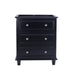 Black chest of drawers with crystal knobs.