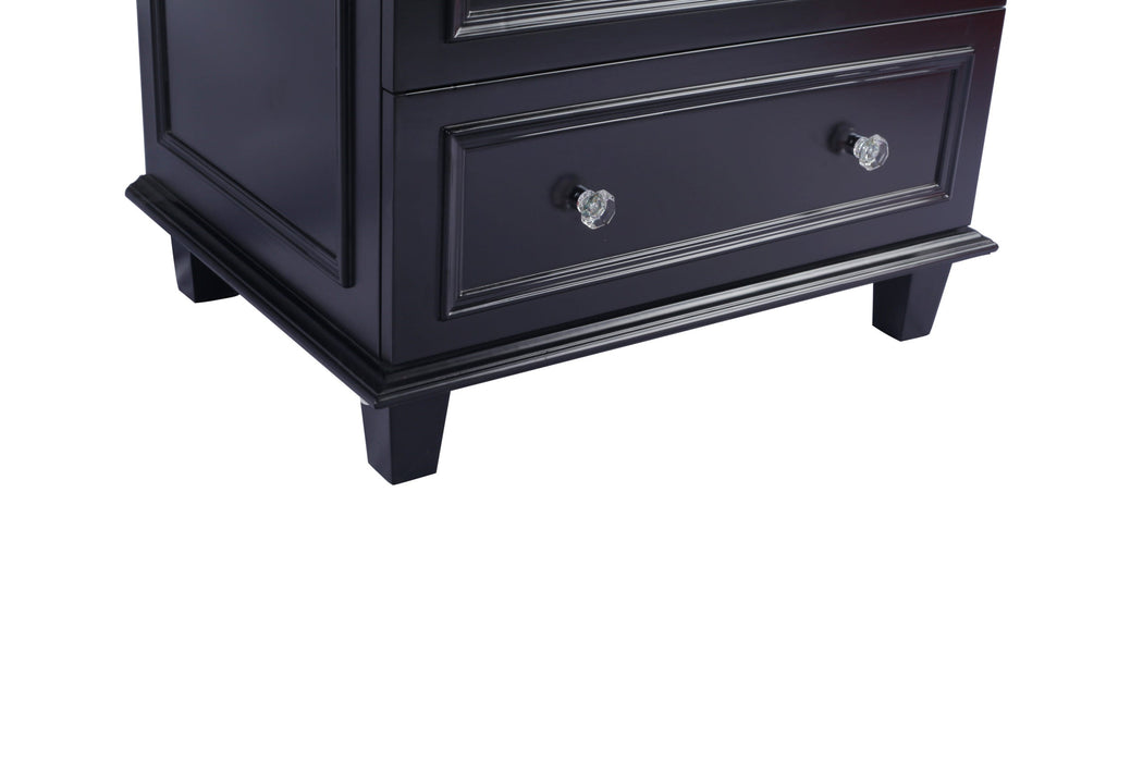 Dark blue dresser with glass knobs.