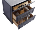 Gray vanity with three open drawers, each with a clear knob, filled with toiletries and grooming items.