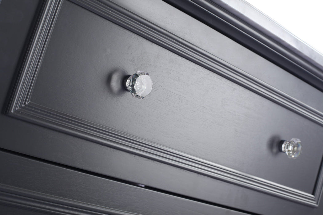 Gray dresser drawer with crystal knobs.
