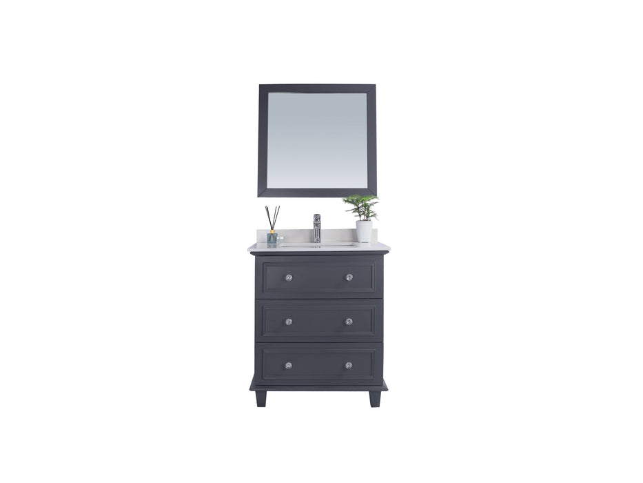 Gray bathroom vanity with mirror, white countertop, silver faucet, and three drawers.