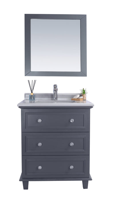 Gray vanity with marble countertop and mirror.