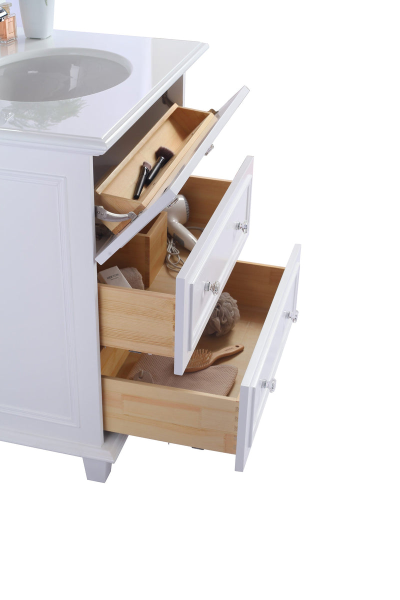 Open white vanity drawers showcasing bathroom essentials.
