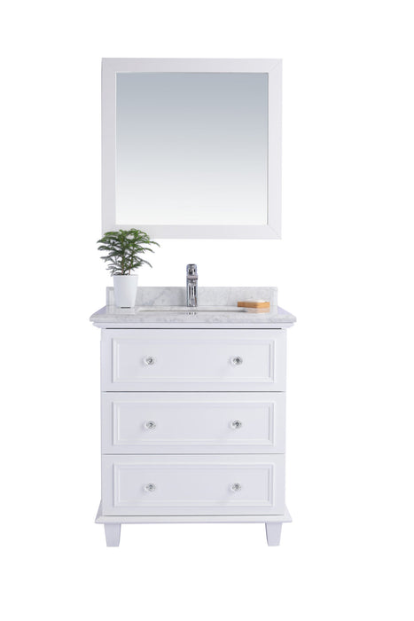 White bathroom vanity with mirror and marble countertop.
