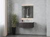 Bathroom with gray marble walls, vanity with sink, and mirror.