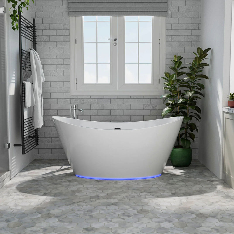 Modern bathroom with white freestanding tub, blue LED base, gray brick walls, and green potted plant near French windows.