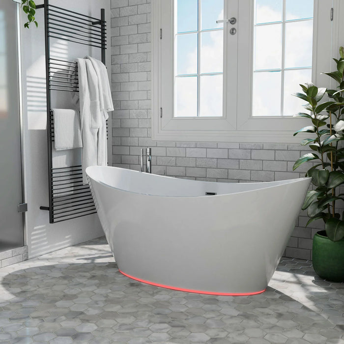 Modern white freestanding bathtub with red LED lighting, placed on hexagonal tile floor in a bright bathroom with brick walls and large windows.