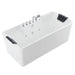 White rectangular whirlpool bathtub with chrome faucet fixtures and black cushioned headrests on each end