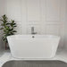 Modern white freestanding bathtub with chrome faucet, placed on marble floor beside a green potted plant against paneled wall.