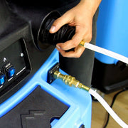Priming-assist hose connected to the solution quick-connect with the cup held to the vacuum inlet