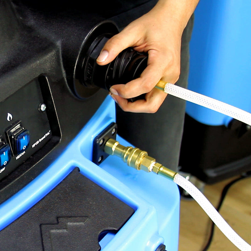 Priming-assist hose connected to the solution quick-connect with the cup held to the vacuum inlet