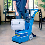 EDIC Fivestar Series Self-Contained Carpet Extractor in use holding detachable tank.