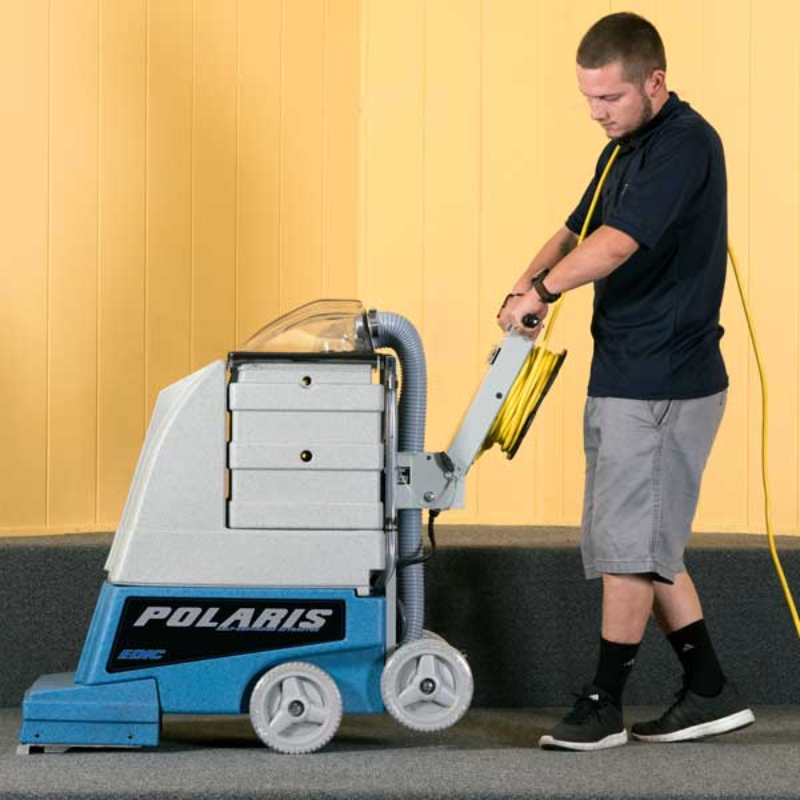 EDIC Polaris Series Self-Contained Carpet Extractors operator using carpet extractor