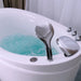 White bathtub filled with turquoise water and chrome faucet, with bubbles and jets creating a swirling effect.