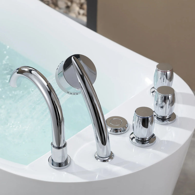 Chrome bathroom faucet and fixtures on a white curved surface with mint green water in background