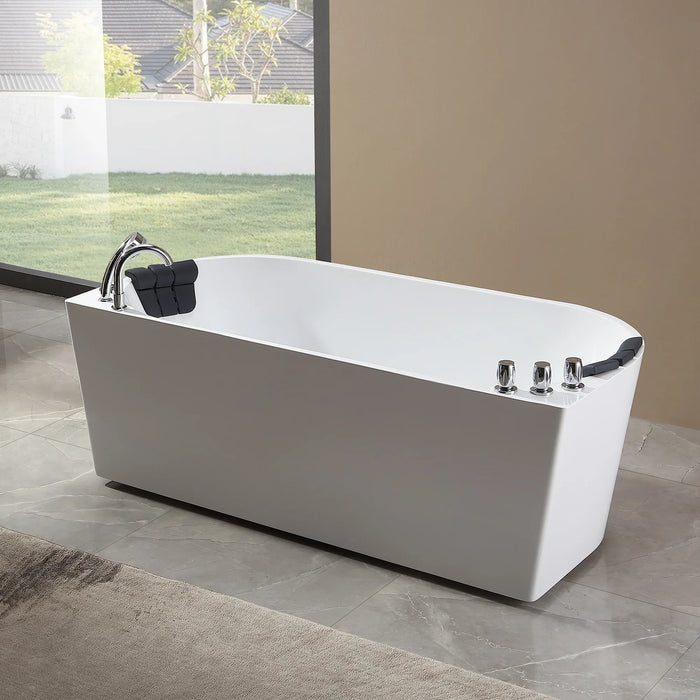 Modern white freestanding bathtub with chrome fixtures, positioned near a large window overlooking a grassy yard with trees.