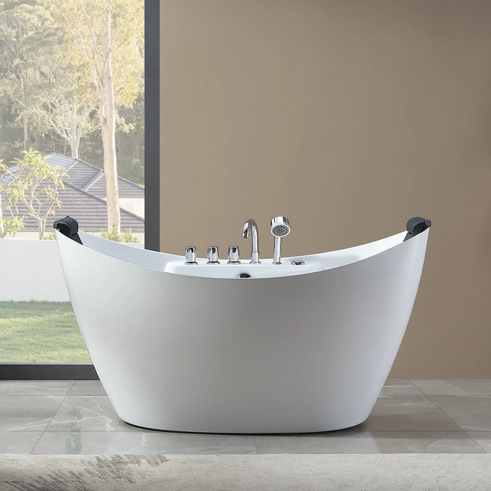 Modern white freestanding bathtub with chrome fixtures, positioned near large window with trees and rooftops visible in background.