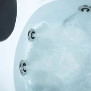 Bubbling hot tub water with three metallic circular jets against a white background