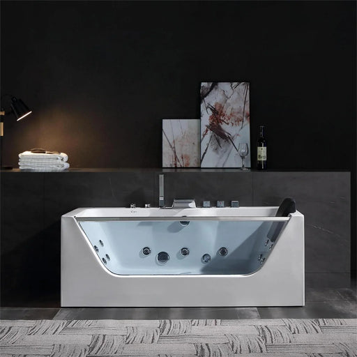 Modern white jacuzzi tub with glass panel, multiple jets, and minimalist bathroom decor featuring abstract art and mood lighting.