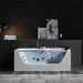 Modern white jacuzzi tub with glass panel, multiple jets, and minimalist bathroom decor featuring abstract art and mood lighting.