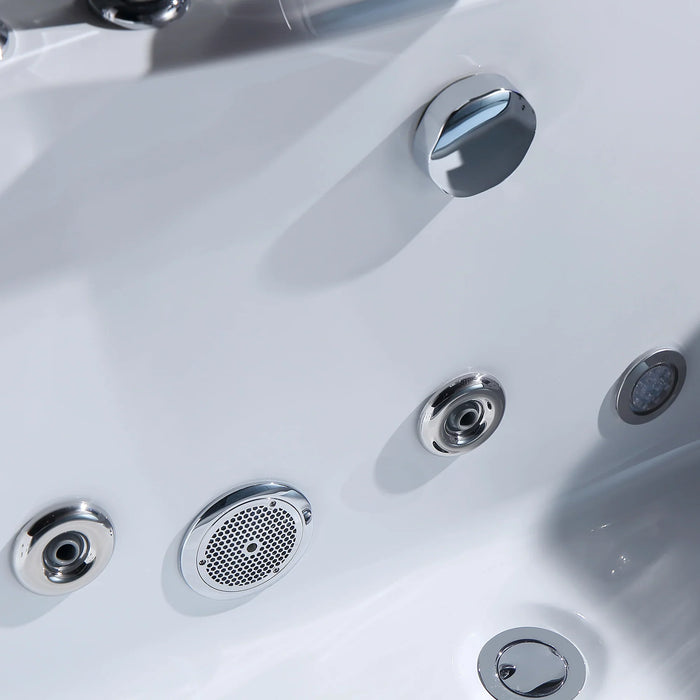 Close-up of white jacuzzi or hot tub with multiple chrome-rimmed jets and control knob