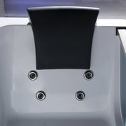 White device with black rectangular accent, four round metallic connection points visible on smooth surface