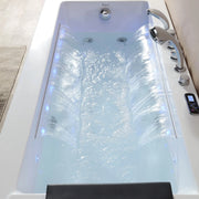 Modern hydrotherapy tub with cascading water jets, blue-tinted water, and digital control panel, creating a spa-like relaxation environment.